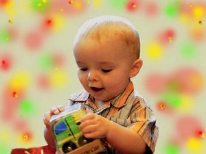 Moorside Stars Nursery - baby playing with boo